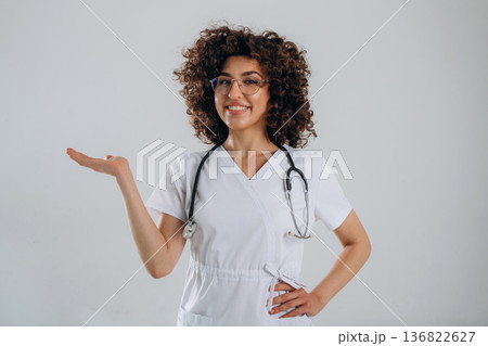 Equipment of stethoscope. Beautiful doctor woman is in the studio Equipment of stethoscope. Beautiful doctor woman is in the studio 136822627
