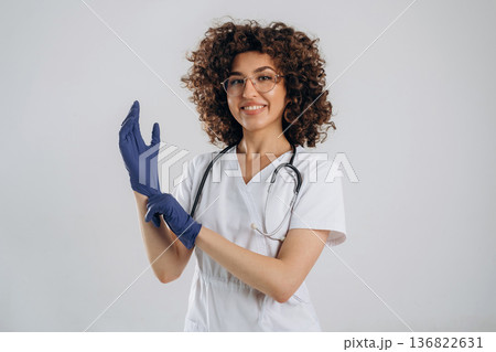 Equipment of stethoscope. Beautiful doctor woman is in the studio Equipment of stethoscope. Beautiful doctor woman is in the studio 136822631