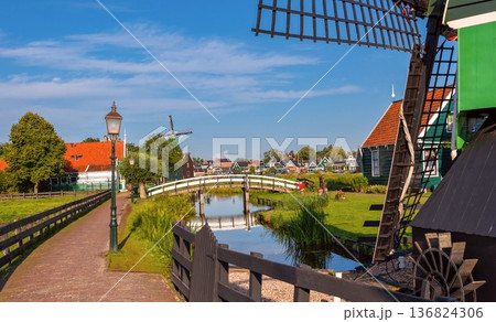 Traditional Dutch Windmills And Wooden Houses In Netherlands Village Traditional Dutch Windmills And Wooden Houses In Netherlands Village 136824306