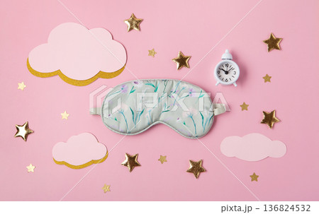 World Sleep Day concept. Bedtime accessories, sleeping mask,  white classic alarm clock on pastel pink background 136824532