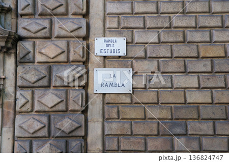 Barcelona, Spain, August 30, 2017: Street sign of La Rambla on an old stone wall Barcelona, Spain, August 30, 2017: Street sign of La Rambla on an old stone wall 136824747