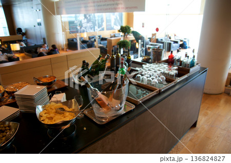 Barcelona, Spain, September 02, 2017: Snack buffet with wine and sparkling wine in a frequent flyer lounge Barcelona, Spain, September 02, 2017: Snack buffet with wine and sparkling wine in a frequent flyer lounge 136824827