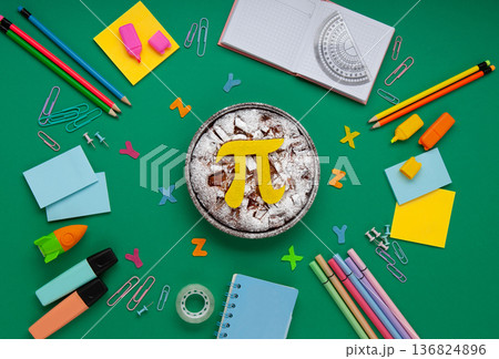 International World Pi day. Homemade apple pie with Pi Symbol and stationery, green background.  March 14th 3,14. Mathematical constant. 136824896