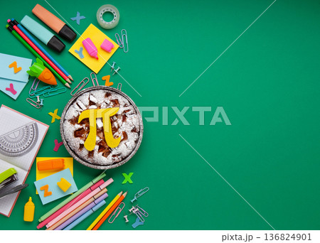 World Pi day. Baked apple pie with Pi Symbol and stationery, green background.   March 14th (3/14). Mathematical constant. 136824901
