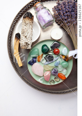 Chakra Crystal Healing Ritual With Lavender Palo Santo White Sage Essential Oils And Candles On White Marble Background Chakra Crystal Healing Ritual With Lavender Palo Santo White Sage Essential Oils And Candles On White Marble Background 136825167