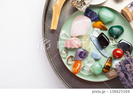 Chakra Crystal Healing Ritual With Lavender Palo Santo White Sage Essential Oils And Candles On White Marble Background 136825169