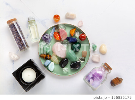 Chakra Crystal Healing Ritual With Lavender Palo Santo White Sage Essential Oils And Candles On White Marble Background 136825173