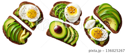 California avocado toast topped with ripe avocado slices, boiled egg, sesame seeds, herbs and sauce, isolated on white background 136825267