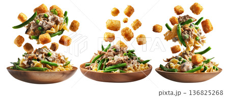 Bowls of green beans, crispy tater tots, and creamy tuna noodle casserole on wooden plate, isolated on white background 136825268