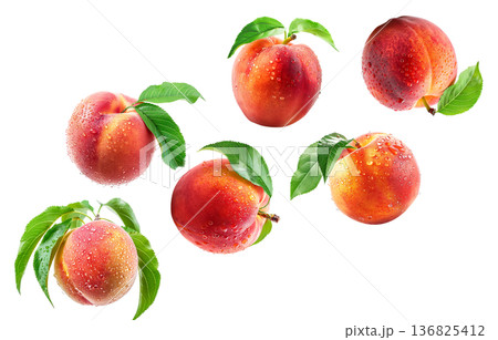 Whole and halved ripe peaches with green leaves and water droplets on white background, freshness and natural fruit concept Whole and halved ripe peaches with green leaves and water droplets on white background, freshness and natural fruit concept 136825412