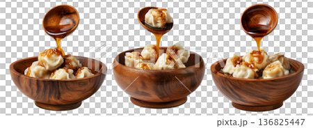 Steamed Faikakai dumplings topped with soy-based glaze, coconut syrup and sesame seeds in wooden bowl on white background Steamed Faikakai dumplings topped with soy-based glaze, coconut syrup and sesame seeds in wooden bowl on white background 136825447