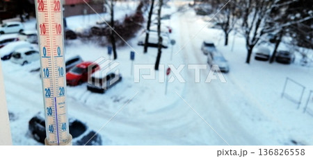 outdoor thermometer showing a temperature below freezing of -20 degrees 136826558