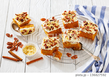 Carrot cake squares with cream cheese and pecan 136827592