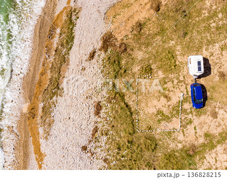 Caravan trailer camping on coast. Aerial view 136828215