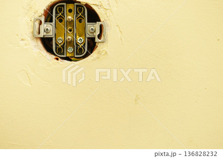 Hole in wall with wires for light switch. Hole in wall with wires for light switch. 136828232