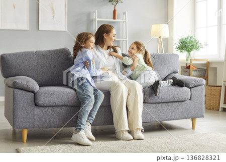 Mother Son And Daughter Laughing And Bonding Together At Home Mother Son And Daughter Laughing And Bonding Together At Home 136828321