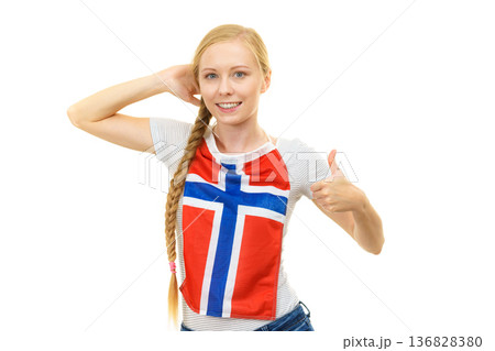 Young woman holding norwegian flag. Education. Young woman holding norwegian flag. Education. 136828380