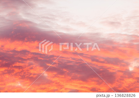 Colorful warm clouds on sky at sunset Colorful warm clouds on sky at sunset 136828826
