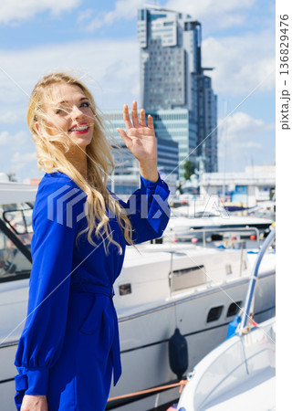Fashion model wearing blue jumpsuit Fashion model wearing blue jumpsuit 136829476