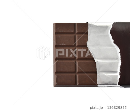 Chocolate bar wrapped in paper and foil on a white background Chocolate bar wrapped in paper and foil on a white background 136829855