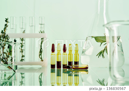 Herbal extract ampoules and plants in chemistry lab Herbal extract ampoules and plants in chemistry lab 136830567
