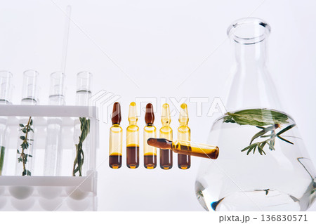 Herbal extracts in ampoules and laboratory glassware for natural medicine research 136830571