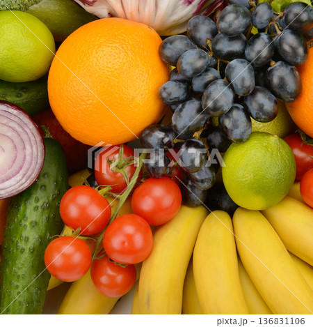 Fresh Seasonal Fruits and Vegetables Arranged in a Bright Organic Food Background 136831106