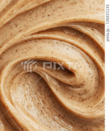 Creamy cosmetic smear in macro style on neutral cappuccino backdrop showing skincare texture with smooth detail concept 136831138