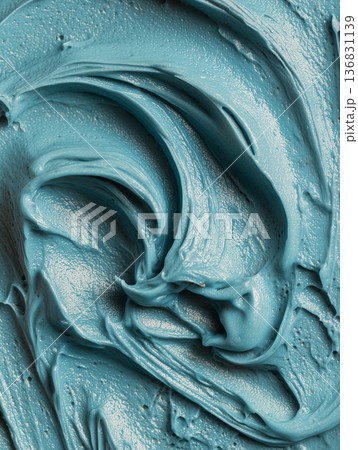 Closeup of blue cyan creamy texture of skincare mask in macro style on neutral background symbolizing creativity and material flow 136831139