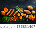 Top view of natural vitamin A sources on black surface, balanced nutrition and healthy diet concept 136831407