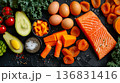 Assortment of antioxidant rich foods containing vitamin A on dark surface, balanced meal planning concept 136831416
