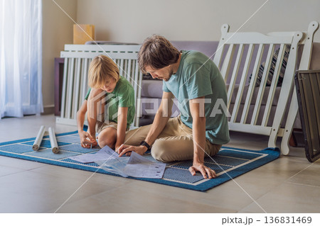 Father and older brother assembling a baby crib at home, preparing for a newborn arrival. Warm family moment full of care and anticipation. Parenthood, sibling bond and home preparation concept Father and older brother assembling a baby crib at home, preparing for a newborn arrival. Warm family moment full of care and anticipation. Parenthood, sibling bond and home preparation concept 136831469