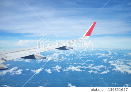 The wing of an airplane flying over the island of Borneo, Malaysia. The wing of an airplane flying over the island of Borneo, Malaysia. 136831627