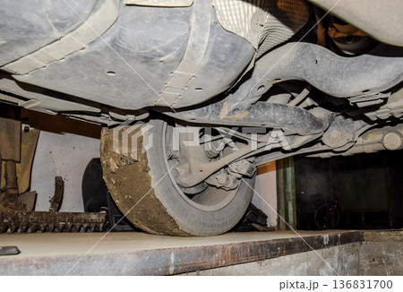 Rear wheel of the car with the elements of the suspension system. Car service Rear wheel of the car with the elements of the suspension system. Car service 136831700