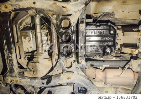 View of the car from below. Autoservice center. Car maintenance. View of the car from below. Autoservice center. Car maintenance. 136831702