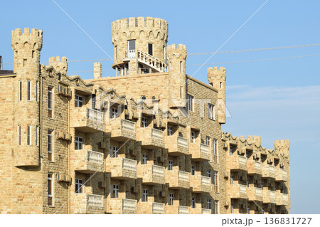 The hotel building, covered with decorative stone 136831727