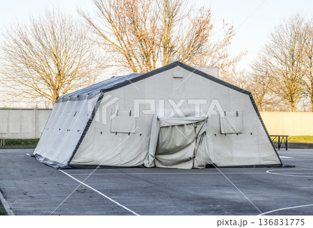huge tent for a large group of people. Army headquarters tent. Awning canopy. 136831775