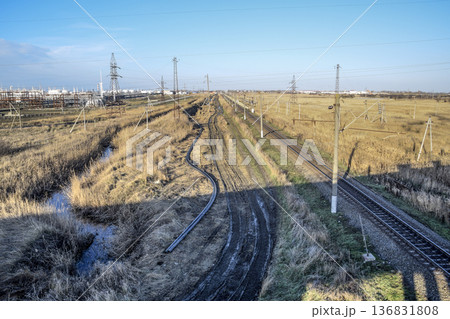 Plot railway. Top view on the rails. High-voltage power lines for electric trains Plot railway. Top view on the rails. High-voltage power lines for electric trains 136831808