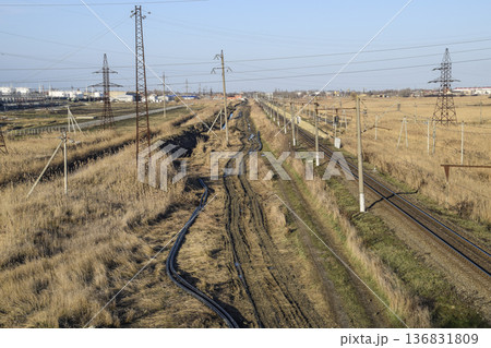 Plot railway. Top view on the rails. High-voltage power lines for electric trains Plot railway. Top view on the rails. High-voltage power lines for electric trains 136831809