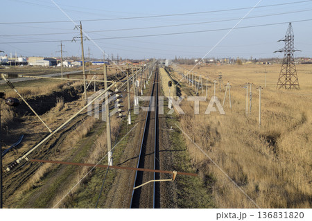 Plot railway. Top view on the rails. High-voltage power lines for electric trains Plot railway. Top view on the rails. High-voltage power lines for electric trains 136831820
