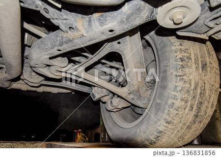 Rear wheel of the car with the elements of the suspension system. Car service 136831856