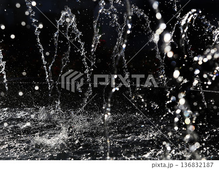 'Frozen' dropes of water in fountain of capital city or NYC in Central park : shiny in sunbeams 'Frozen' dropes of water in fountain of capital city or NYC in Central park : shiny in sunbeams 136832187