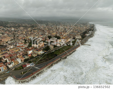 Climate change tsunami destroys coastline and buildings, storm surge aerial view Climate change tsunami destroys coastline and buildings, storm surge aerial view 136832502