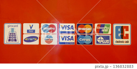 Berlin, Germany - July 17, 2025: Payment method logos displayed on bright red background for transactions Berlin, Germany - July 17, 2025: Payment method logos displayed on bright red background for transactions 136832883