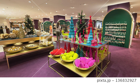 Berlin, Germany - September 19, 2025: Colorful holiday decorations displayed in a vibrant retail store setting Berlin, Germany - September 19, 2025: Colorful holiday decorations displayed in a vibrant retail store setting 136832927