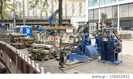Berlin, Germany - September 22, 2025: Construction site with machinery and stone materials in urban environment Berlin, Germany - September 22, 2025: Construction site with machinery and stone materials in urban environment 136832932