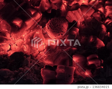 Heat From Coal in a Furnace Creates Bright Red Embers and Ash in a Dark Space 136834015