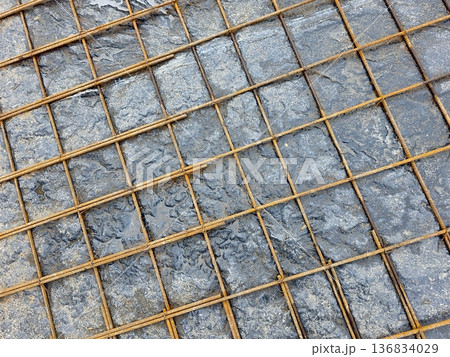 Reinforcing Mesh Placed on Wet Concrete During Construction on a Building Site Reinforcing Mesh Placed on Wet Concrete During Construction on a Building Site 136834029