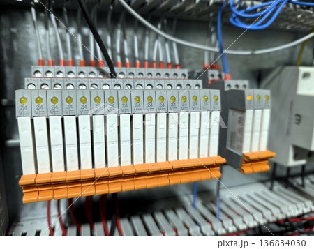 Relay Block in an Electrical Cabinet Showing Various Connections and Wiring Setup Relay Block in an Electrical Cabinet Showing Various Connections and Wiring Setup 136834030