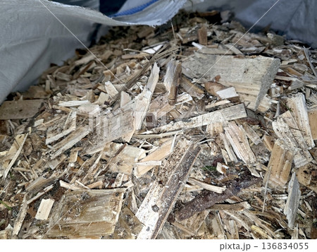 Wood Chip Pile Stored in a Bag for Gardening or Landscaping Needs 136834055